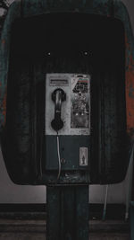 Close-up of old telephone booth