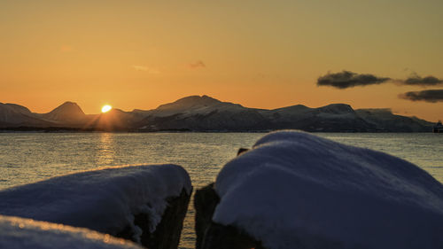 Scenic view of lake against sky during sunset