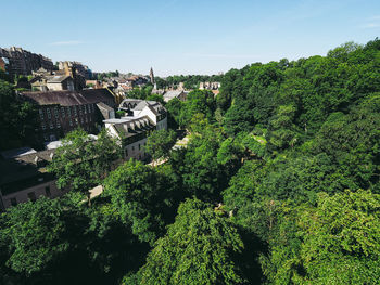 High angle view of trees and buildings against sky