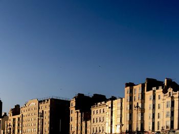 View of buildings against blue sky