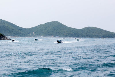 Scenic view of boats in sea