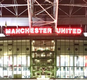 Low angle view of illuminated text on building