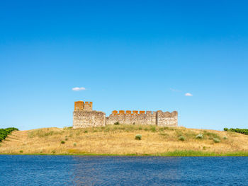 View of fort against blue sky