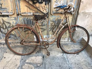 Bicycle parked on metal structure