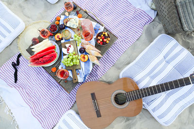 High angle view of guitar on table