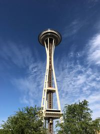 Low angle view of communications tower against sky