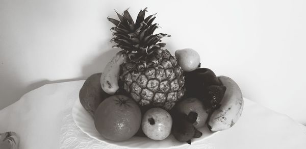 Close-up of fruits in plate on table