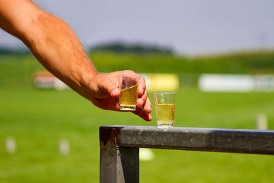 Close-up of hand holding drink