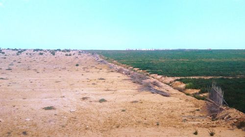 Scenic view of land against clear sky