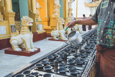 Statue of buddha against building