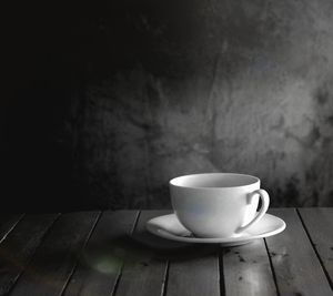 Close-up of coffee cup on table