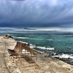 Scenic view of sea against cloudy sky