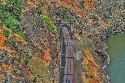 High angle view of road amidst rocks and trees