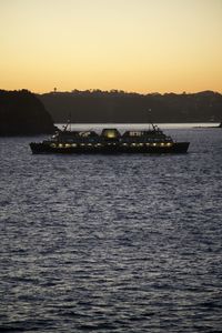 Scenic view of sea against clear sky during sunset