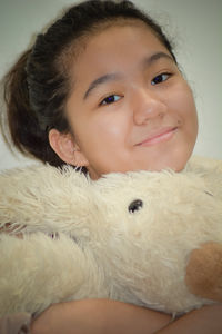 Portrait of smiling boy with toy