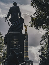 Low angle view of statue against sky