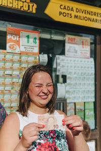 Portrait of a smiling woman with text