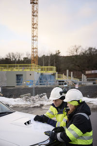 Engineers talking at building site