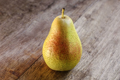 Close-up of pear on wooden table