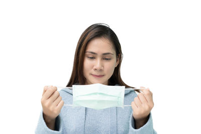 Portrait of a beautiful young woman over white background