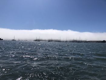 Scenic view of sea against blue sky