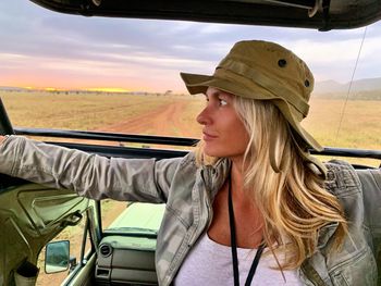 Close-up of woman looking away in jeep