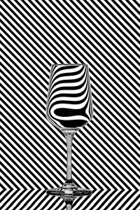 Close-up of wineglass against pattern wall