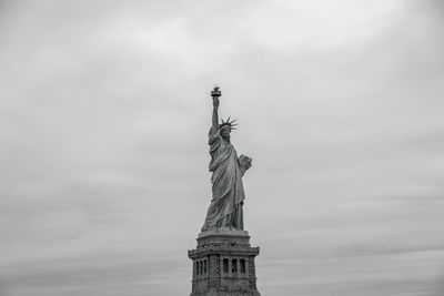 Low angle view of statue against sky