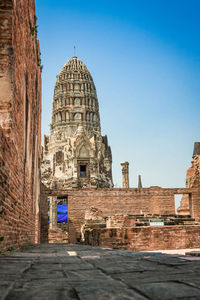 Low angle view of historic building against clear blue sky