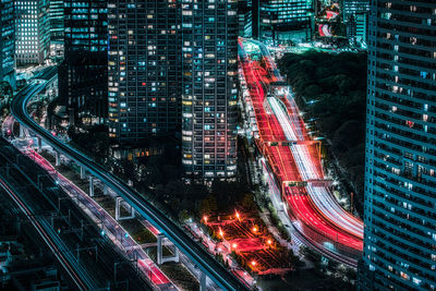 High angle view of illuminated city buildings at night