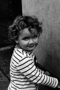 Portrait of cute girl standing outdoors