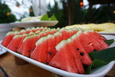 Close-up of watermelon slices in plate on table