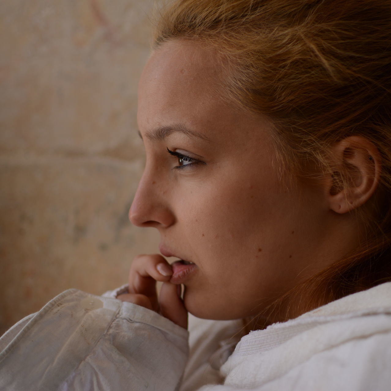 headshot, person, close-up, lifestyles, indoors, human face, contemplation, childhood, head and shoulders, young adult, focus on foreground, leisure activity, looking away, front view, innocence, portrait, serious