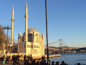 Tourists on bridge over river