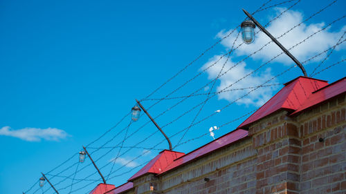 Low angle view of buildings against blue sky