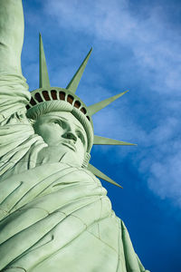 Low angle view of statue against cloudy sky