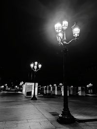 Illuminated street lights at night