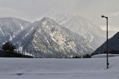 Scenic view of snowcapped mountains against sky