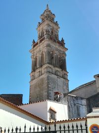 Low angle view of building against blue sky