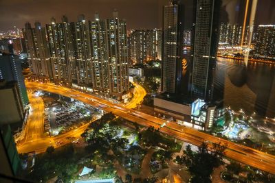High angle view of illuminated city buildings at night