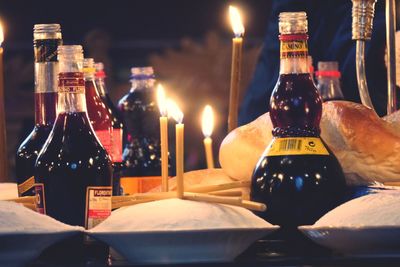 Close-up of wine bottles on table