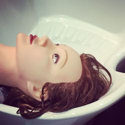 Portrait of woman lying down in bathroom