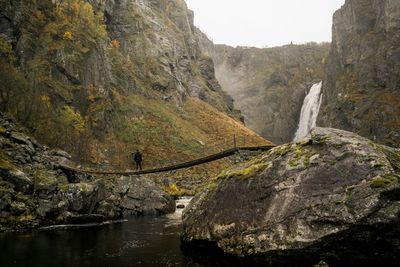 Scenic view of river flowing through rocks