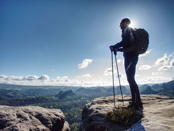 Hikers in mountains. male strong carrier with backpack and camping on hike in nature. travel concept