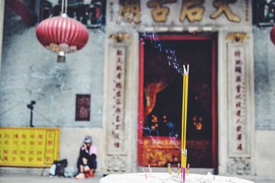 Woman standing against wall