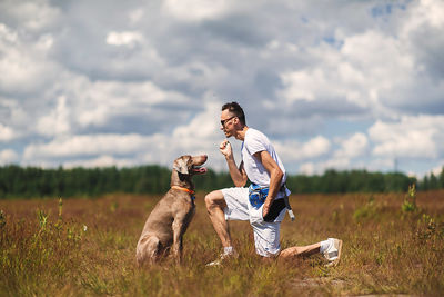 Full length of a dog on field