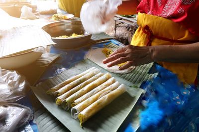 High angle view of woman preparing food on table