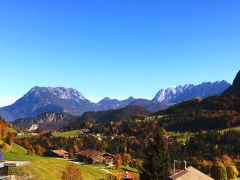 Scenic view of mountains against clear blue sky