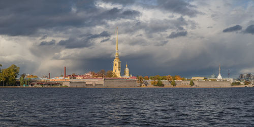 View of buildings against cloudy sky