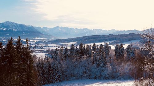 Scenic view of mountains against sky during winter